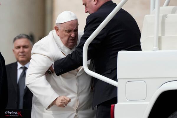 FILE - Pope Francis helped to get on his car at the end of weekly general audience in St. Peter's Square, at the Vatican, Wednesday, March 29, 2023. (AP Photo/Alessandra Tarantino, File)