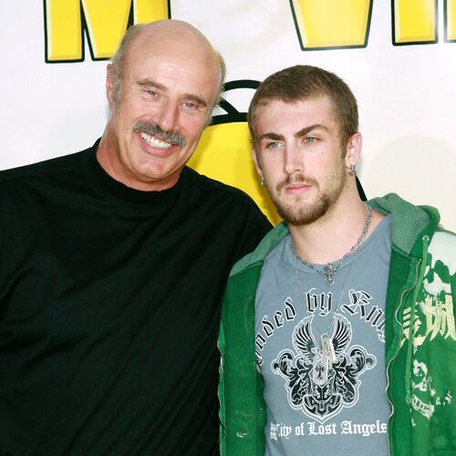 FILE - Dr. Phil McGraw, left, and his son, Jordan McGraw, arrive at the premiere of 'The Simpsons Movie' in Los Angeles, July 24, 2007. (AP Photo/Matt Sayles, File)