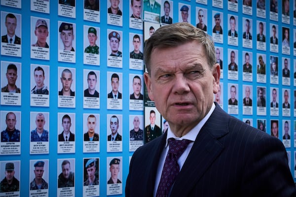 German Foreign Minister Johann Wadephul attend a flower laying ceremony at the Memory Wall of Fallen Defenders of Ukraine in Kyiv, Ukraine, Monday, June 30, 2025. (AP Photo/Efrem Lukatsky)
