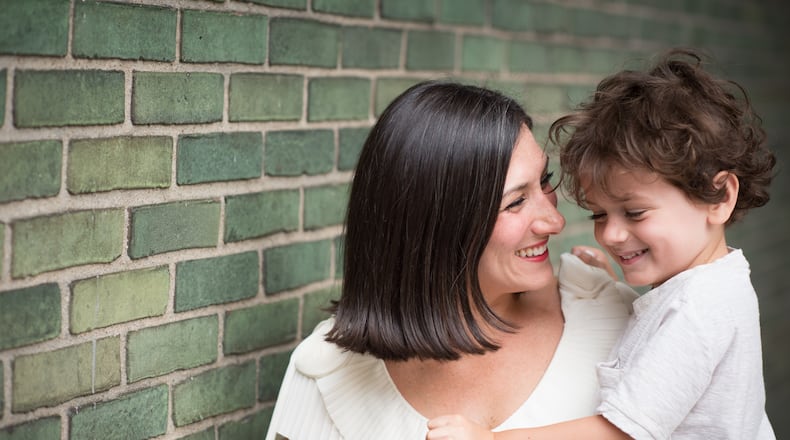 Lauren Smith Brody, author of "The Fifth Trimester," poses with one of her sons. Photo: Nancy Borowick