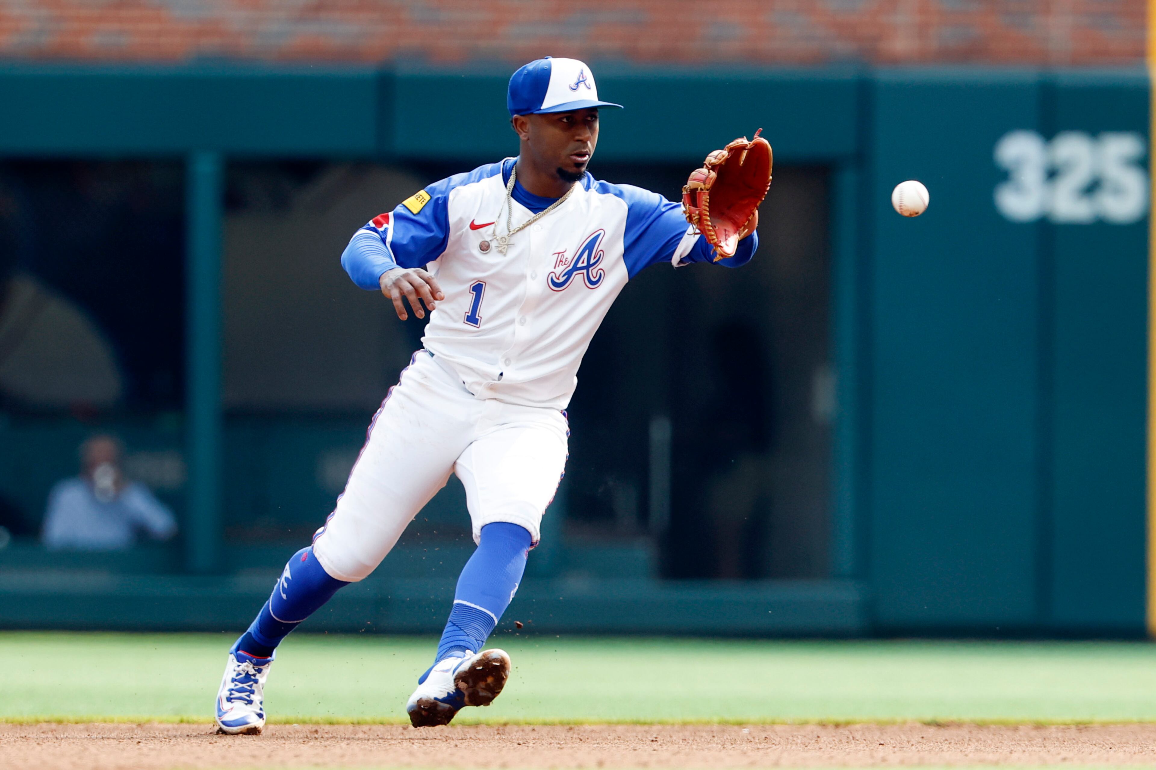Atlanta Braves second baseman Ozzie Albies fields a ground ball hit by Boston Red Sox's Jarren Duran during the fourth inning of a baseball game, Saturday, May 31, 2025, in Atlanta. (AP Photo/Butch Dill)