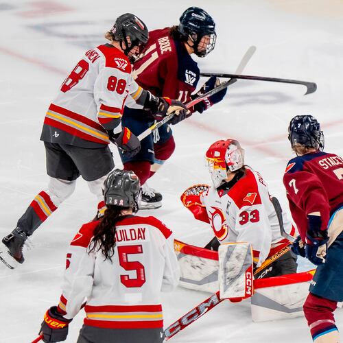 Montreal Victoire's Abby Roque (11) scores on Ottawa Charge goaltender Gwyneth Philips (33) during overtime of a PWHL playoff hockey game in Laval, Quebec, Thursday, May 14, 2026. (Christopher Katsarov/The Canadian Press via AP)