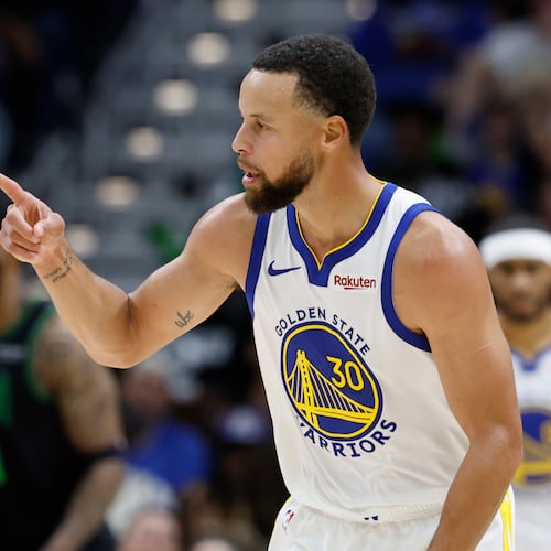 Golden State Warriors guard Stephen Curry reacts to a three-point basket against the New Orleans Pelicans during the third quarter of an NBA basketball game, Sunday, Nov. 16, 2025, in New Orleans. (AP Photo/Butch Dill)
