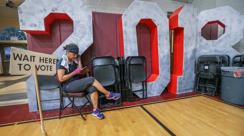 Chandra Brown was first in line at Henry W. Grady High School in Atlanta on Tuesday May 22, 2018. Voters across the state reported to their regular precincts to decide on candidates for governor, Congress and statewide races in the Democratic and Republican primaries. JOHN SPINK/JSPINK@AJC.COM