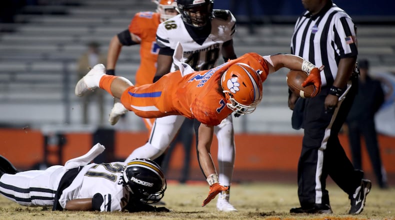 State playoff action in Lilburn: Parkview running back Cody Brown (7) scores on an eight-yard run in the first half of the Class AAAAAAA playoffs against Colquitt County. (Jason Getz/Special)