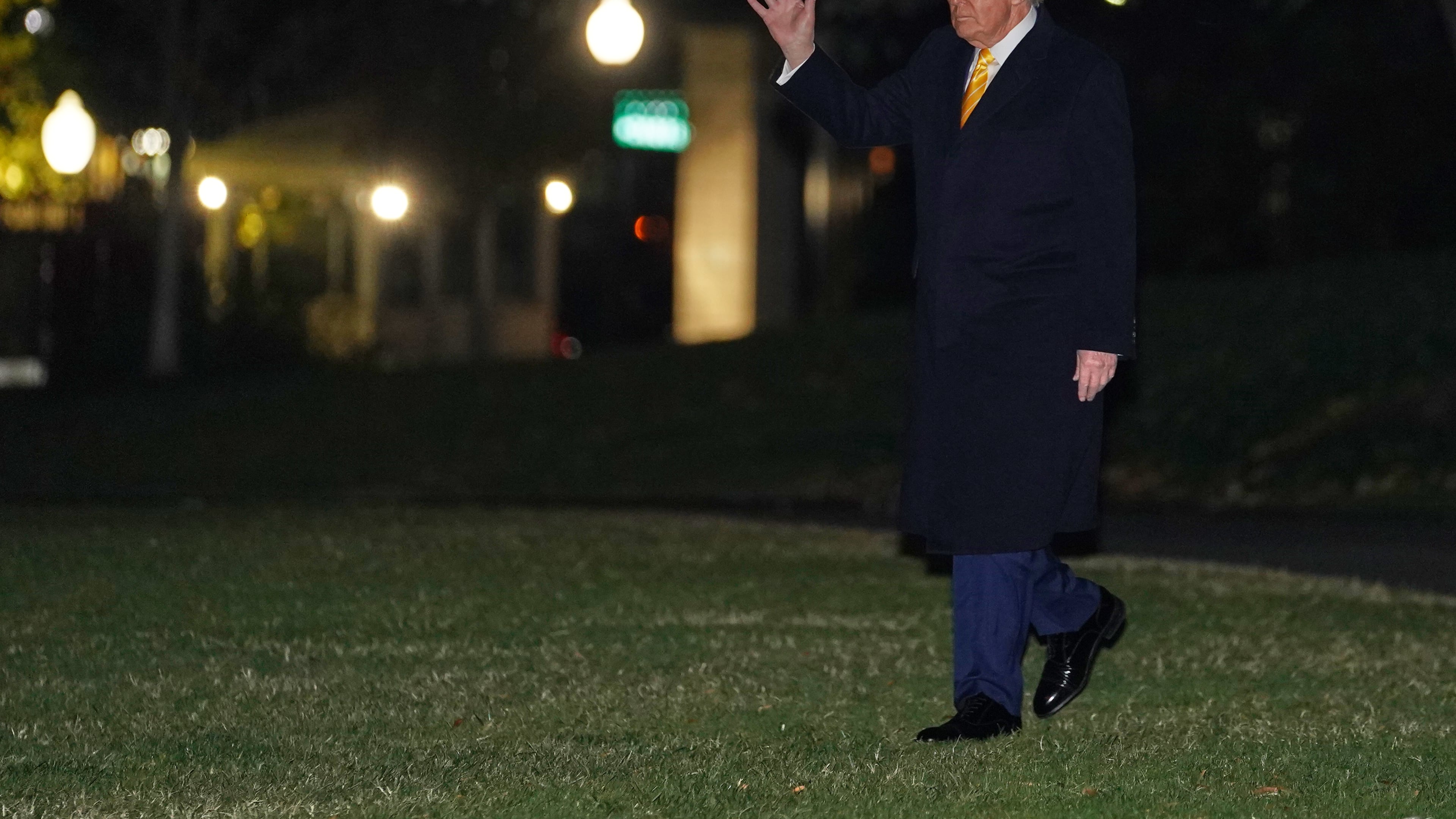 President Donald Trump waves as he walks to board Marine One, Friday, Nov. 14, 2025, on the South Lawn of the White House, in Washington for a trip to Palm Beach, Fla. (AP Photo/Allison Robbert)