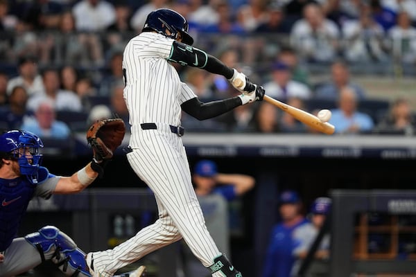 New York Yankees' Cody Bellinger hits a home run during the fifth inning of a baseball game against the Chicago Cubs, Friday, July 11, 2025, in New York. (AP Photo/Yuki Iwamura)