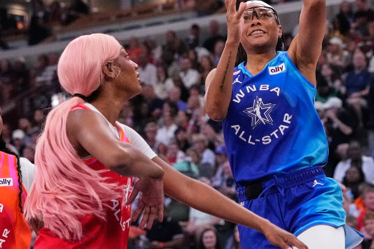 Team Spoon's Allisha Gray, right, drives to the basket against Team Coop's Angel Reese, left, during the first half of a WNBA All-Star basketball game in Chicago, Saturday, July 25, 2026. (AP Photo/Nam Y. Huh)