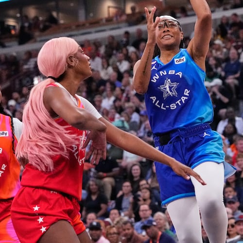 Team Spoon's Allisha Gray, right, drives to the basket against Team Coop's Angel Reese, left, during the first half of a WNBA All-Star basketball game in Chicago, Saturday, July 25, 2026. (AP Photo/Nam Y. Huh)