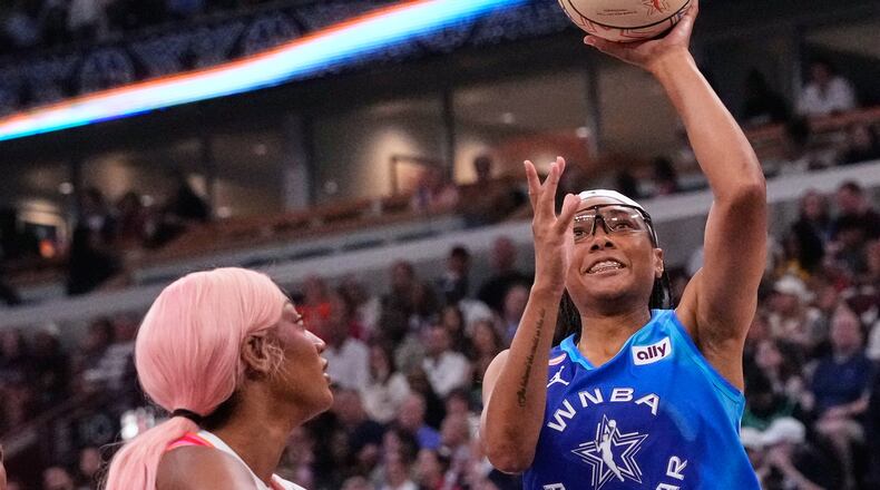 Team Spoon's Allisha Gray, right, drives to the basket against Team Coop's Angel Reese, left, during the first half of a WNBA All-Star basketball game in Chicago, Saturday, July 25, 2026. (AP Photo/Nam Y. Huh)