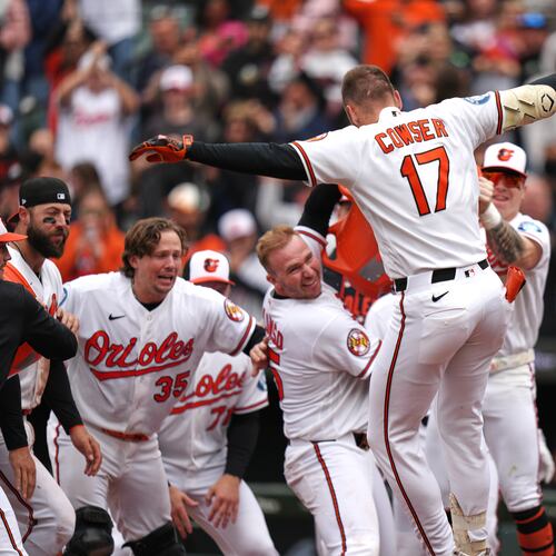 Baltimore Orioles' Colton Cowser (17) celebrates with teammates after hitting a walkoff three-run home run during the ninth inning in the first baseball game of a doubleheader against the Detroit Tigers, Sunday, May 24, 2026, in Baltimore. (AP Photo/Stephanie Scarbrough)