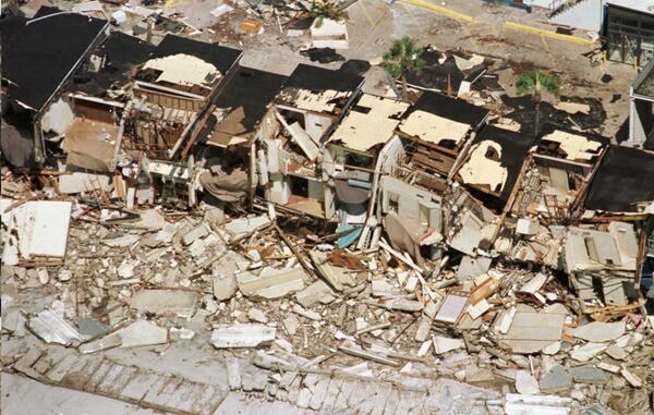 HURRICANE OPAL, 1995: A row of destroyed townhouses sit along Panama City beach on October 5, 1995 after Hurricane Opal pounded the Florida Panhandle. Hurricane Opal was a Category 3 hurricane when it made landfall near Pensacola. Storm surges were reported up to 20 feet along the Panhandle area. Damages were estimated to be almost $3 billion. (TONY RANZE/AFP/Getty Images)
