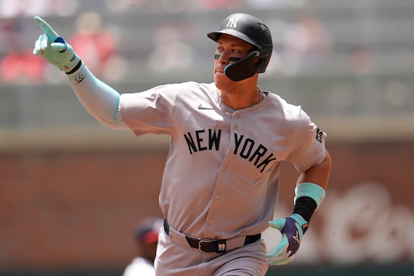 New York Yankees' Aaron Judge (99) celebrates his solo home run against the Atlanta Braves in the first inning of a baseball game, Sunday, July 20, 2025, in Atlanta. (AP Photo/Mike Stewart)