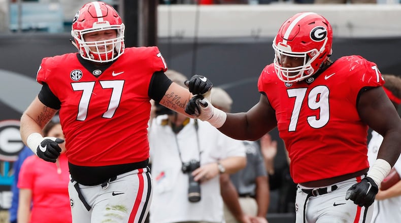 Former UGA star Isaiah Wilson (right). BOB ANDRES / BANDRES@AJC.COM