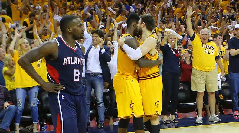 Hawks guard Shelvin Mack looks on as Cleveland celebrates a 114-111 victory in over time in the Eastern Conference finals on Sunday. (Curtis Compton/ccompton@ajc.com)