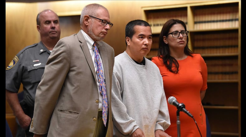 Lishan Wang, center, appears in court with Chief Public Defender Thomas Ullmann, left, during his sentencing at New Haven Superior Court Friday, Sept. 22, 2017, in New Haven, Connecticut.