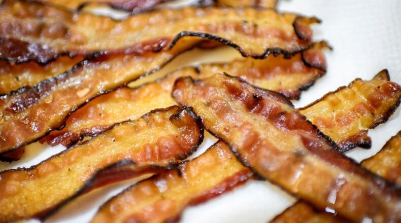 Bacon isn't going to disappear; if anything, it's just going to get harder to find - and, by extension - more expensive. (Glen Stubbe/Minneapolis Star Tribune/TNS)