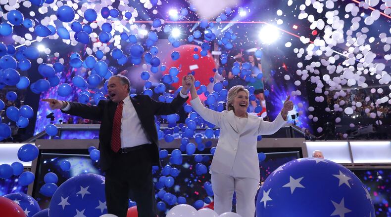 PHILADELPHIA, PA - JULY 28: Democratic presidential candidate Hillary Clinton and US Vice President nominee Tim Kaine acknowledge the crowd at the end on the fourth day of the Democratic National Convention at the Wells Fargo Center, July 28, 2016 in Philadelphia, Pennsylvania. Democratic presidential candidate Hillary Clinton received the number of votes needed to secure the party's nomination. An estimated 50,000 people are expected in Philadelphia, including hundreds of protesters and members of the media. The four-day Democratic National Convention kicked off July 25. (Photo by Chip Somodevilla/Getty Images)