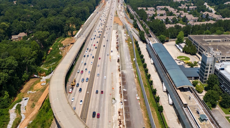 Aerial photo shows Ga. 400 (R-Northbound, L-Southbound), where toll lanes will be built on Thursday, July 22, 2021. North Springs MARTA station is shown on right. Sixteen miles of toll lanes are planned that will stretch from the North Springs MARTA station in Fulton County to about one mile north of McFarland Parkway in Forsyth County. (Hyosub Shin / Hyosub.Shin@ajc.com)