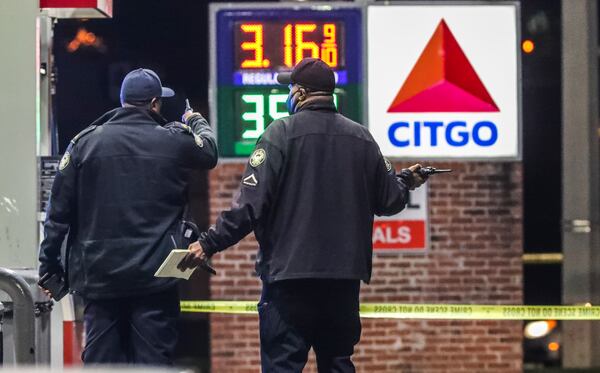 November 2, 2021 Atlanta: Atlanta police are investigating after a woman was found shot to death early Tuesday morning, Nov. 2, 2021 at a northwest Atlanta gas station. The shooting occurred along Sandy Creek Drive, but police responded to a Citgo gas station on Martin Luther King Jr. Drive shortly before 2 a.m. regarding the wounded woman. She was dead when officers arrived. Her name was not released. A gray Jeep was part of the crime scene and investigators had its doors open. Authorities did not say if the woman drove the Jeep from Sandy Creek Drive to the gas station or if she was found inside it. Police said witnesses at the gas station were cooperative but did not say if they saw the shooting. (John Spink / John.Spink@ajc.com)

