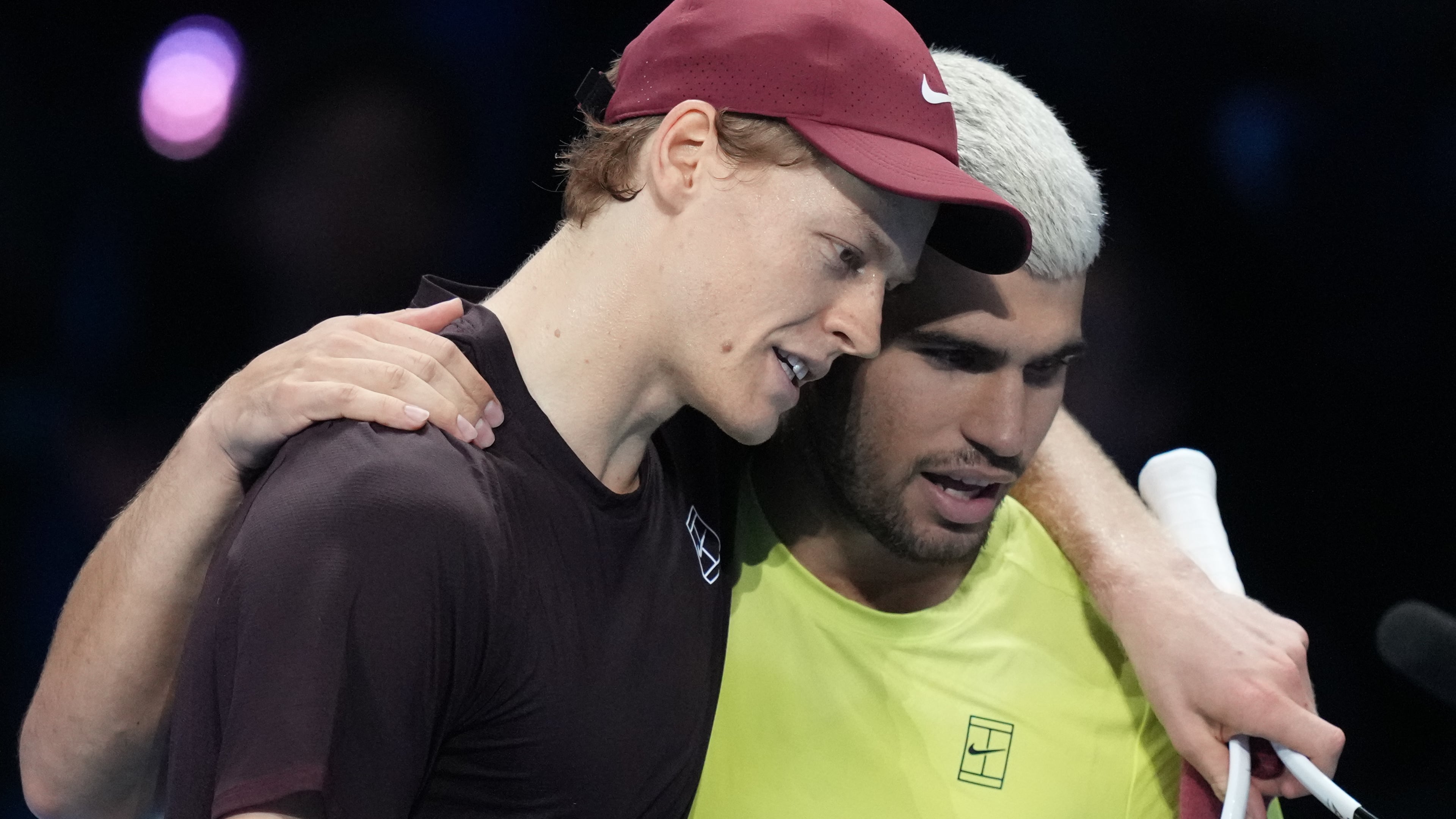 Italy's Jannik Sinner, left, and Spain's Carlos Alcaraz hug after the final tennis match of the ATP World Tour Finals, in Turin, Italy, Sunday, Nov. 16, 2025. (AP Photo/Antonio Calanni)