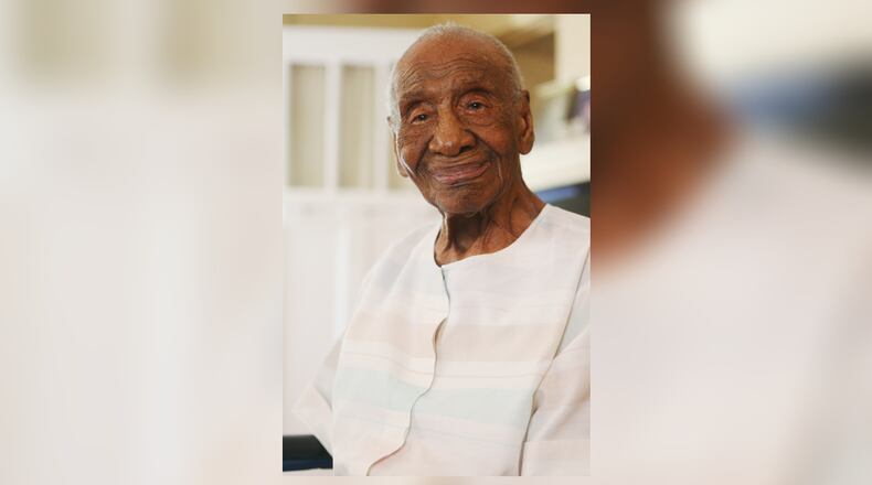 Willie Mae Hardy smiles for a portrait at her home in Decatur, Georgia on Thursday, July 18, 2019. At 111 years old, Hardy is the oldest living African-American in the United States. Hardy was born in 1908 in Junction City, Georgia, and was the granddaughter of a slave. She moved to Atlanta in 1939 looking for a better life for her and her late daughter, Cassie, and has lived in the city ever since. Veronica Edwards, Hardy's granddaughter, is the primary caregiver for Hardy. Hardy had the opportunity to meet former First Lady Michelle Obama during Obama's book tour in May.(Christina R. Matacotta / Christina.Matacotta@ajc.com)
