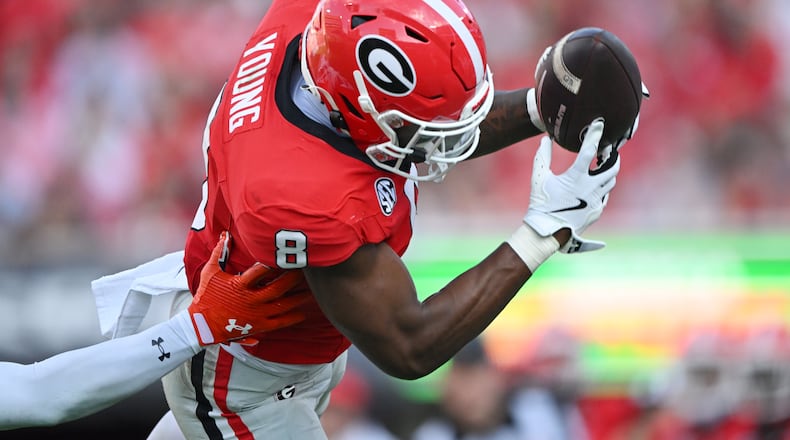 Georgia wide receiver Colbie Young (8) makes a catch for a first down during the second half in an NCAA football game at Sanford Stadium, Saturday, October 5, 2024, in Athens. Georgia won 31-13 over Auburn. (Hyosub Shin / AJC)
