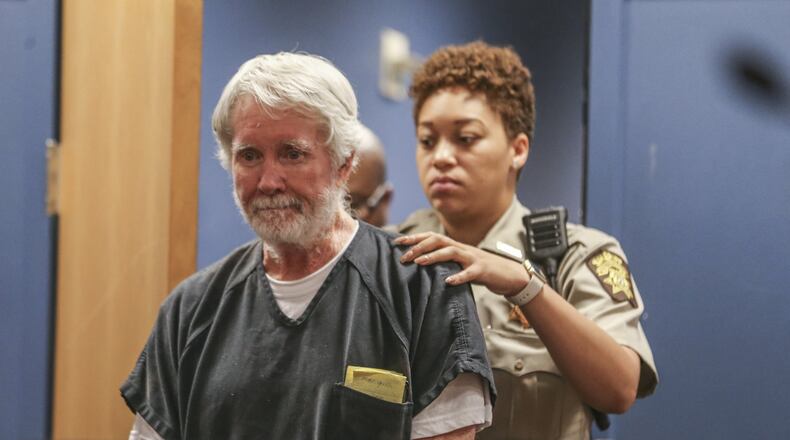 Fulton County deputy, K. Jackson brings Claud “Tex” McIver into the courtroom for a recent appearance. McIver shot his wife Diane as they rode in their SUV in midtown Atlanta in the fall of 2016. McIver has said it was an accident but faces murder charges. JOHN SPINK/JSPINK@AJC.COM.