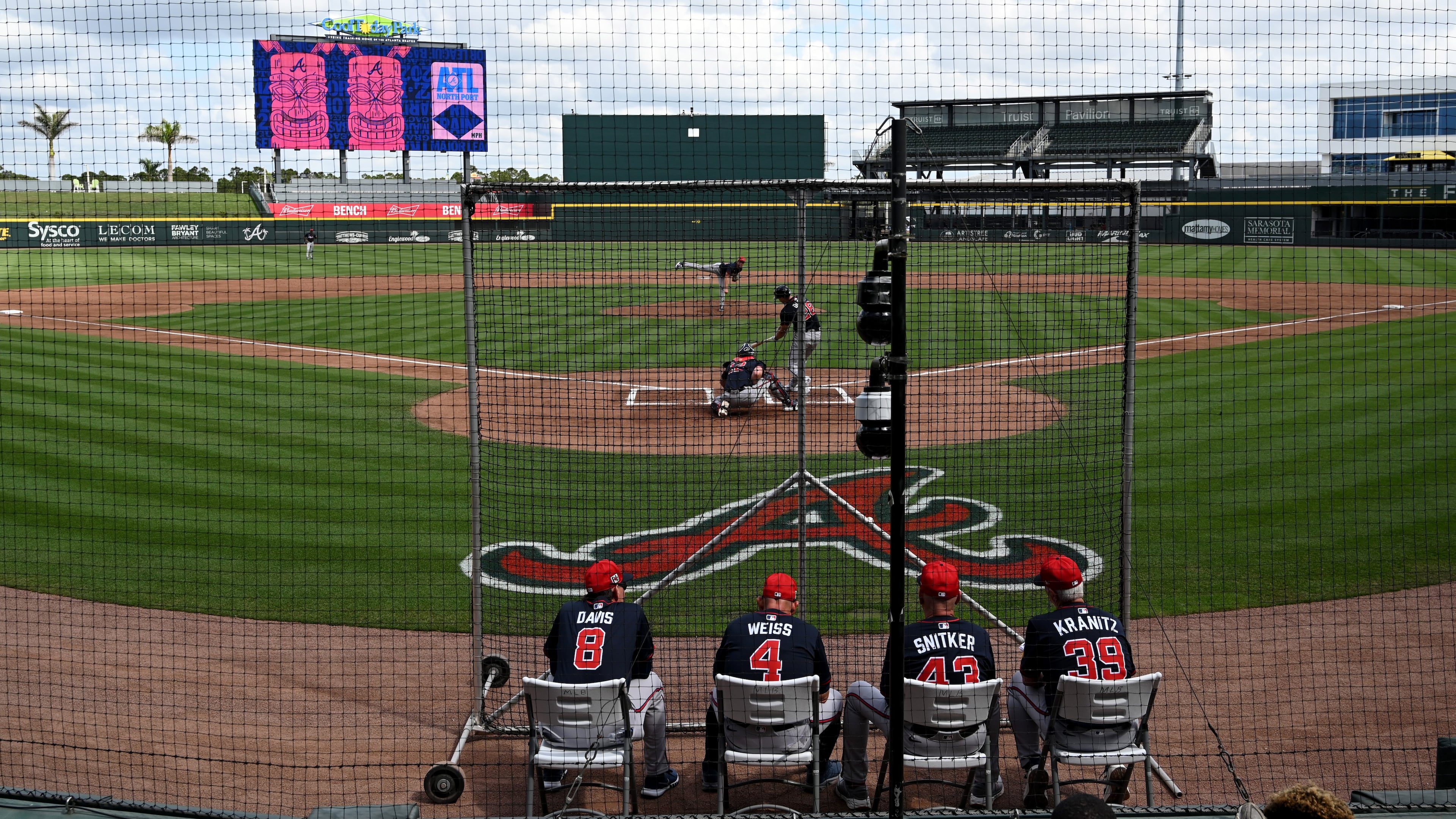 Atlanta Braves then-manager Brian Snitker and other coaches watch batting practice during February's first full-squad spring training workout at CoolToday Park in Florida. (Hyosub Shin/AJC)