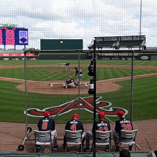 Atlanta Braves then-manager Brian Snitker and other coaches watch batting practice during February's first full-squad spring training workout at CoolToday Park in Florida. (Hyosub Shin/AJC)