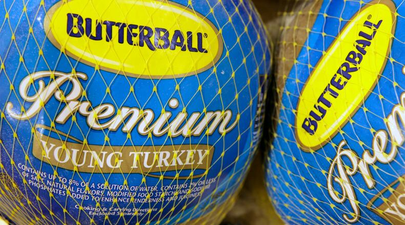 FILE - In this file photo made Dec. 7, 2009, Butterball frozen turkeys are on display at Heinen's grocery store in Bainbridge Township, Ohio. Butterball, which has been fielding phone calls from Thanksgiving cooks for more than 35 years, is letting people text their turkey-related questions this year for the first time. The company’s regular phone help line begins Tuesday, Nov. 1, 2016. Butterball will start take text message questions on Nov. 17, 2016, and continue through Thanksgiving Day. (AP Photo/Amy Sancetta, File)