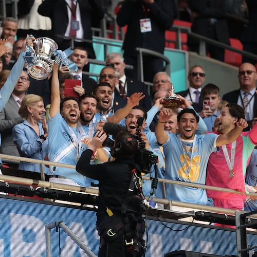 Manchester City players celebrate with the winner's trophy after the English FA Cup final soccer match between Chelsea and Manchester City in London, Saturday, May 16, 2026. (AP Photo/Richard Pelham)