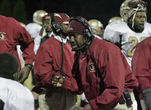Creekside's coach, Kevin Whitley, charging his troops during the 2nd quarter at Marist in Dunwoody Friday, December 1, 2006.  (Louie Favorite/AJC)