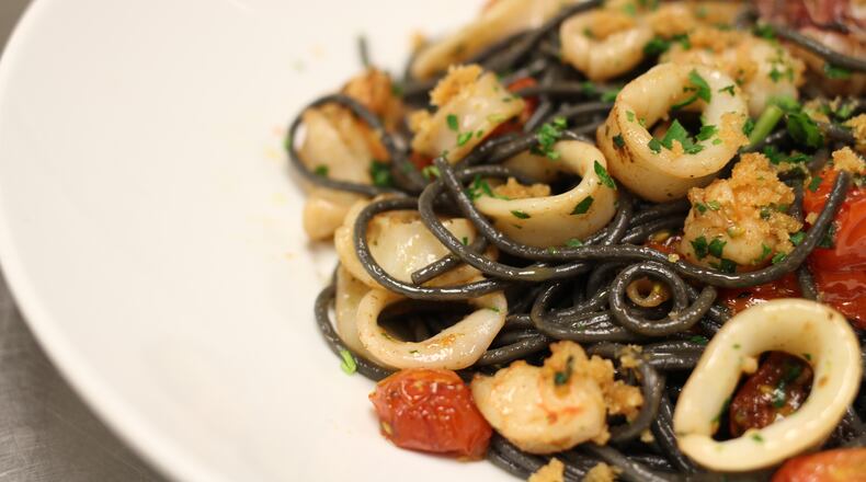 Linguini Con Nero di Seppia e Gamberi from Baraonda in Midtown. Chef Costanzo Astarita pairs linguini with sauce of calamari and shrimp cooked with white wine, Calabrese peppers and other seasonings. Read more about the black pasta trend and places to try it in Atlanta here.Photo credit: Eddie Johnson/ Styling credit: Chef Costanzo Astarita
