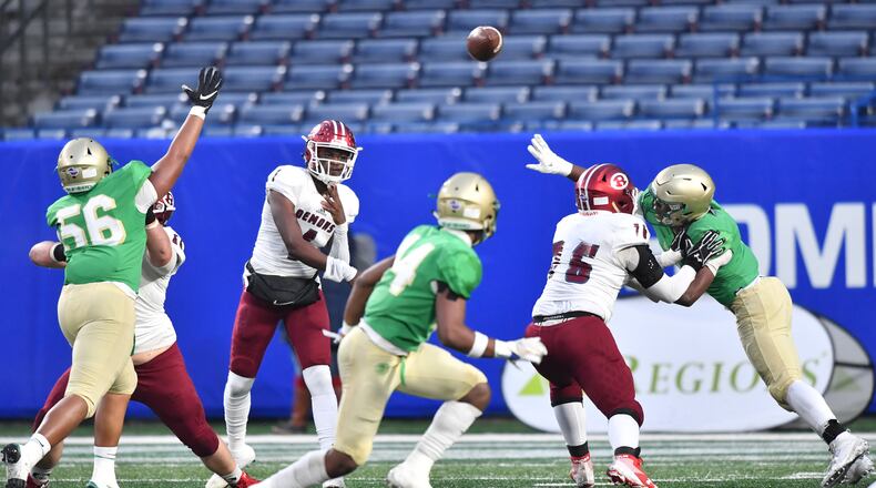 Warner Robins quarterback Jalen Addie (1) gets off a pass in the first half. (Hyosub Shin / Hyosub.Shin@ajc.com)