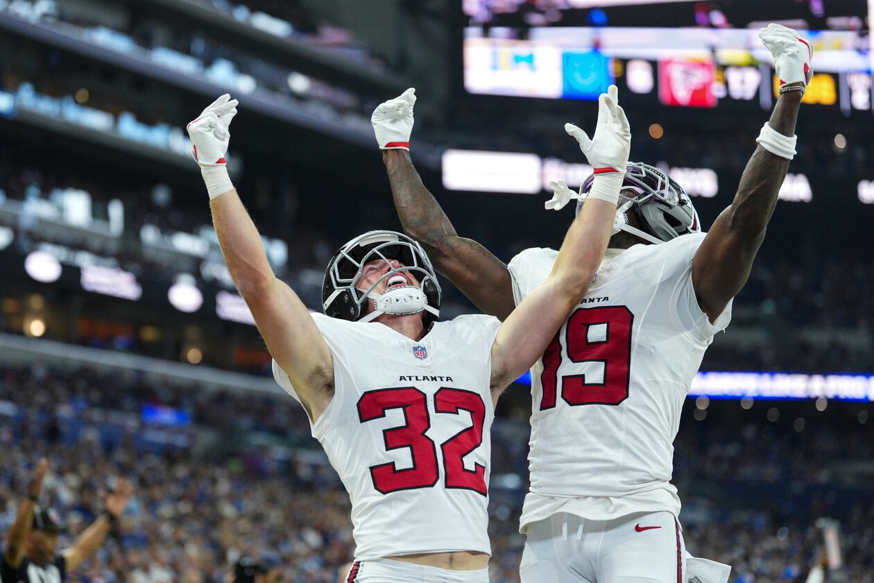 Atlanta Falcons running back Cash Jones (32) celebtes his touchdown with wide receiver Chris Blair (19) against the Indianapolis Colts during the first half of an NFL football game in Indianapolis, Saturday, Aug. 22, 2026. (AP Photo/AJ Mast)