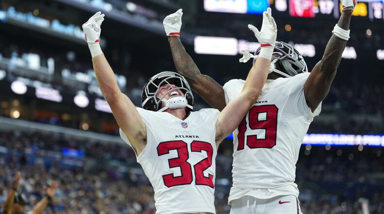 Atlanta Falcons running back Cash Jones (32) celebtes his touchdown with wide receiver Chris Blair (19) against the Indianapolis Colts during the first half of an NFL football game in Indianapolis, Saturday, Aug. 22, 2026. (AP Photo/AJ Mast)