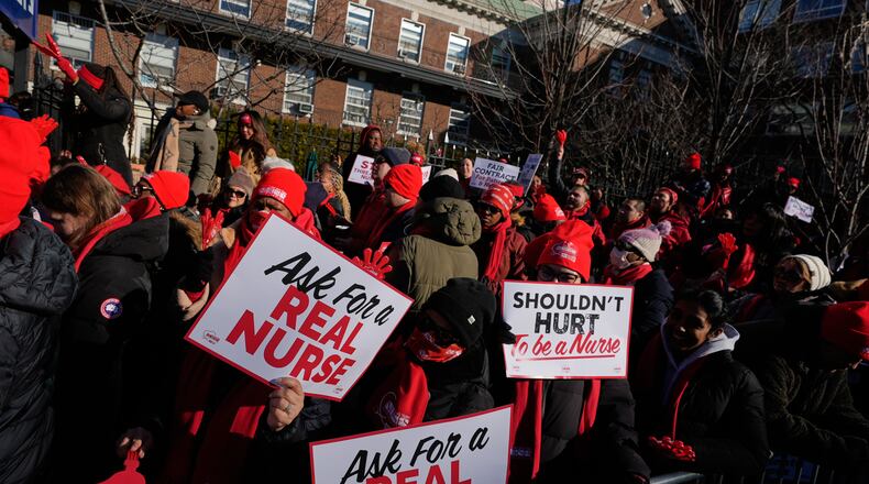 Nurses strike in front of Montefiore Hospital in the Bronx borough of New York, Tuesday, Jan. 13, 2026. (AP Photo/Seth Wenig)