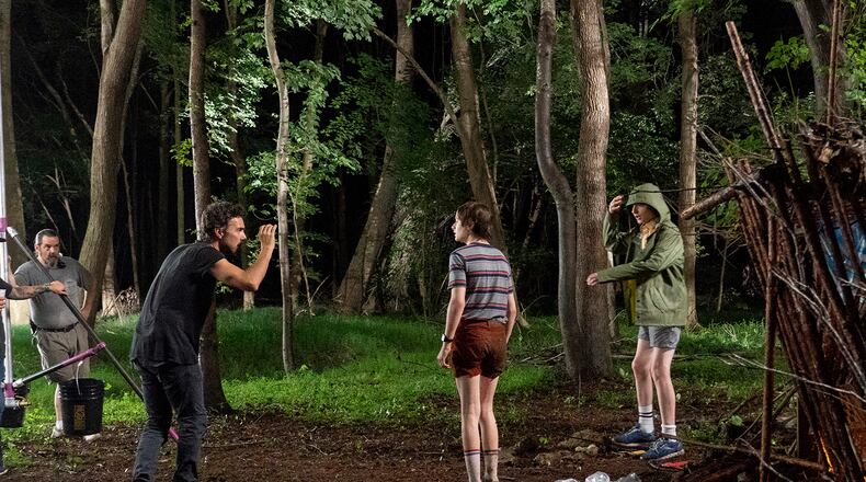 A behind-the-scenes photo of "Stranger Things" from season 3, shot in metro Atlanta. Shown: Shawn Levy, Noah Schnapp, Finn Wolfhard. NETFLIX