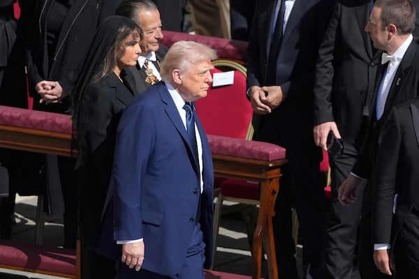 President Donald Trump and first lady Melania Trump arrive for the funeral of Pope Francis in St. Peter's Square at the Vatican, Saturday, April 26, 2025. (AP Photo/Markus Schreiber)