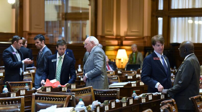 Georgia lawmakers at work in February 2016 on the The House floor. HYOSUB SHIN / HSHIN@AJC.COM