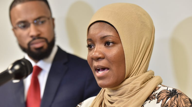 Jalanda Calhoun, a female Muslim correctional officer, filed a complaint with the Georgia Commission on Equal Opportunity, alleging prison officials in Reidsville will not let her wear the hijab. Calhoun is with Edward Ahmed Mitchell, attorney and executive director at CAIR-Georgia, during a news conference in Atlanta on Wednesday. HYOSUB SHIN / HSHIN@AJC.COM