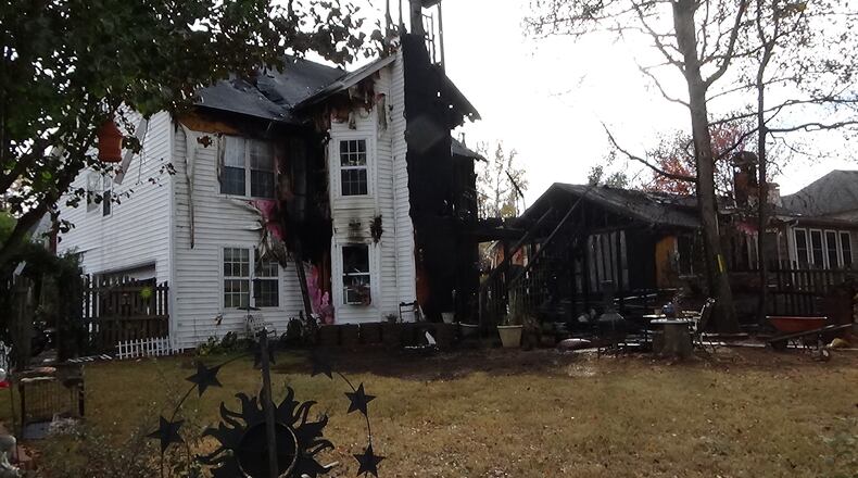 Two homes were damaged in a blaze that killed two cats in Lawrenceville.