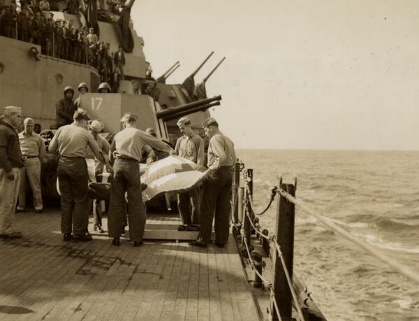 This image provided by the U.S. National Archives shows a burial at sea of the remains of a Japanese pilot whose plane hit the USS Missouri on April 11, 1945. (U.S. National Archives photo no. 80-G-315823 via AP)