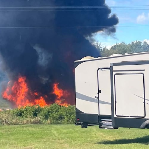 Smoke rises after an F-16 fighter jet crashed in a rural area near Traverse City, Mich., Thursday, Sept. 17, 2026. (Rebecca Lamberson via AP)