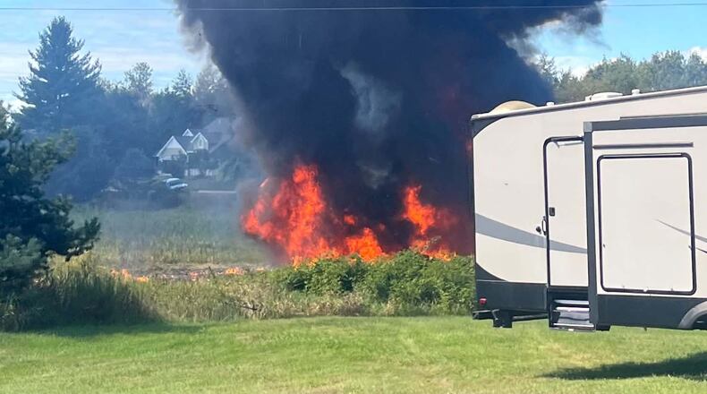 Smoke rises after an F-16 fighter jet crashed in a rural area near Traverse City, Mich., Thursday, Sept. 17, 2026. (Rebecca Lamberson via AP)