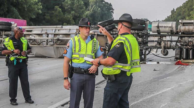 Authorities worked Monday morning to clear the big rig from I-285 at Langford Parkway.