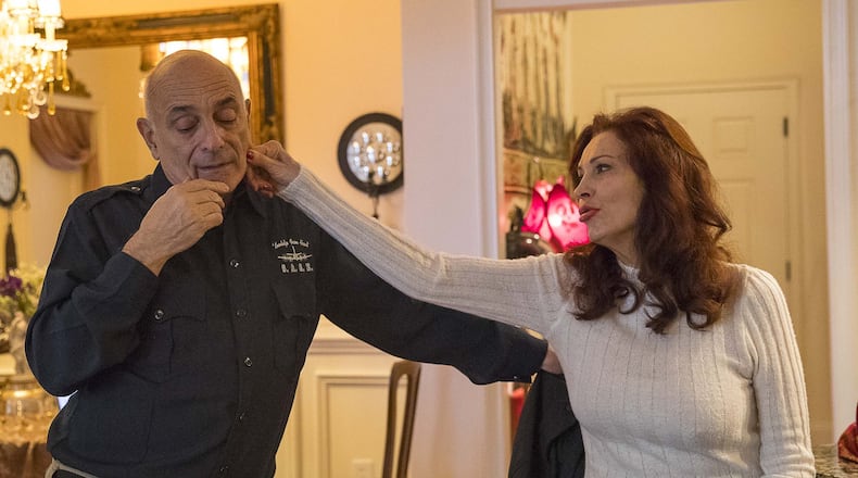 Lynne Russell (right) admires her husband Chuck de Caro as they talk about their relationship while at their residence in Atlanta, Monday, December 9, 2019. Lynne Russell is a former CNN anchor and Chuck de Caro is a former CNN reporter.