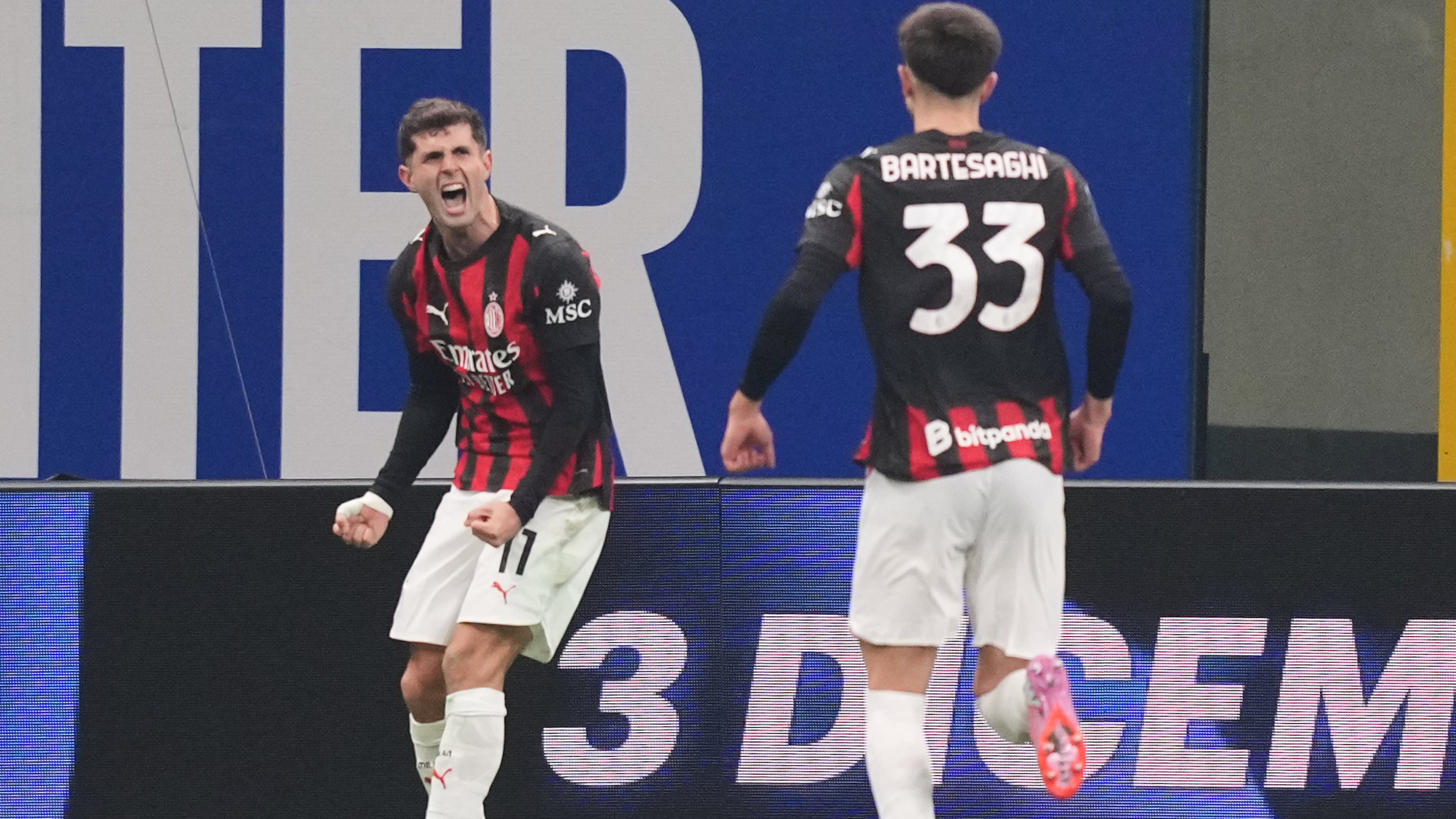 AC Milan's Christian Pulisic celebrates after scoring during the Serie A soccer match between Inter Milan and AC Milan in Milan, Italy, Sunday, Nov. 23, 2025. (AP Photo/Antonio Calanni)