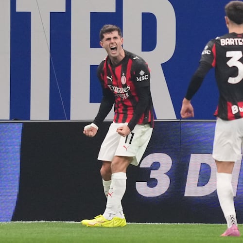 AC Milan's Christian Pulisic celebrates after scoring during the Serie A soccer match between Inter Milan and AC Milan in Milan, Italy, Sunday, Nov. 23, 2025. (AP Photo/Antonio Calanni)